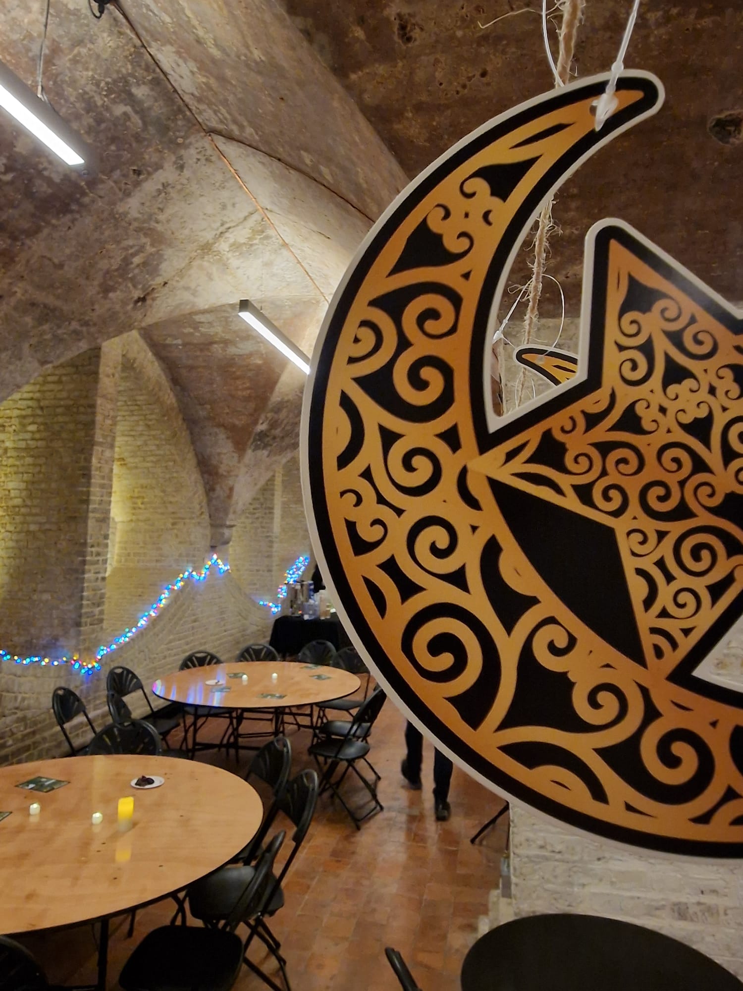 a round tables and chairs in a room with a star