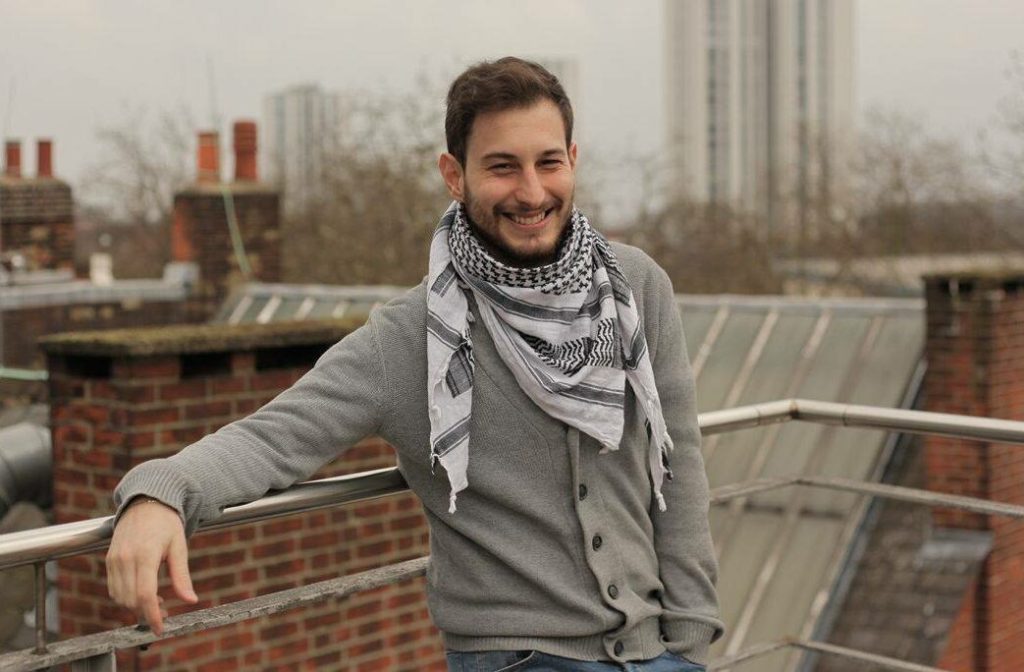 a man leaning on a railing